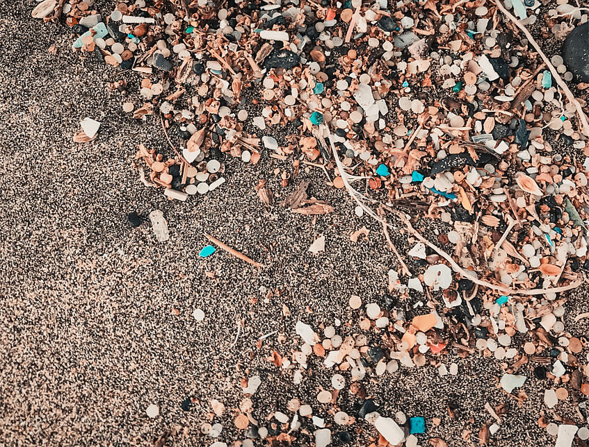 sand beach with micro plastic pollution